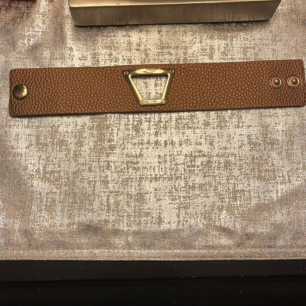 Bronze colored leather band with gold cut out